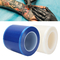 Rotolo di film dentario dinamico della barriera con il film blu adesivo della barriera della scatola dell'erogatore per dentario, medico &amp; il tatuaggio